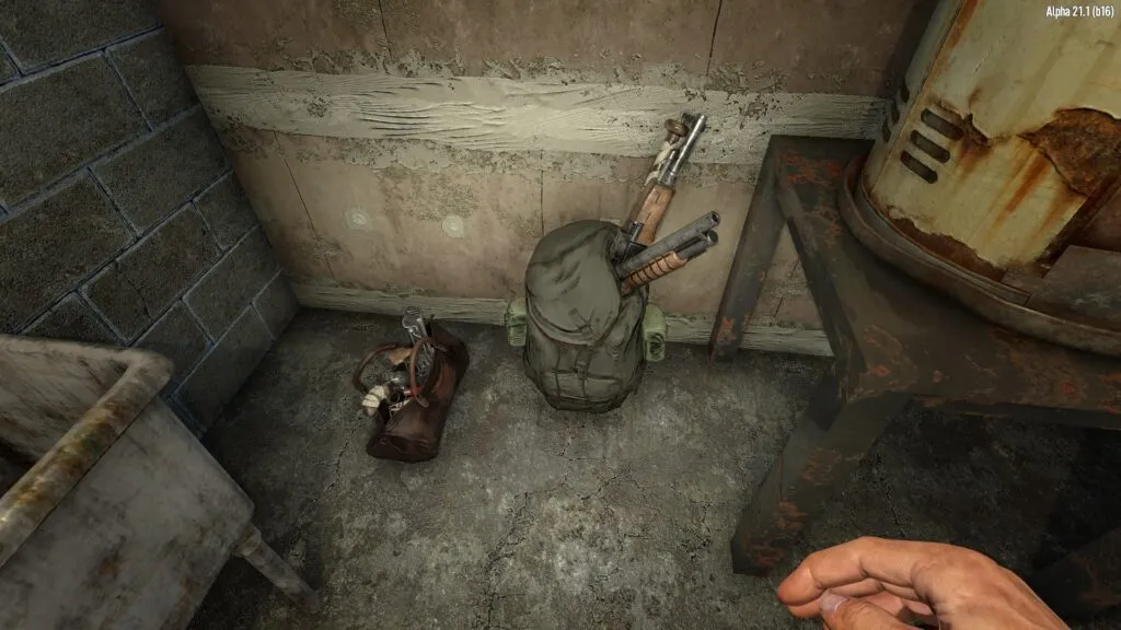 Looking at a Backpack on the Ground with Weapons Sticking Out