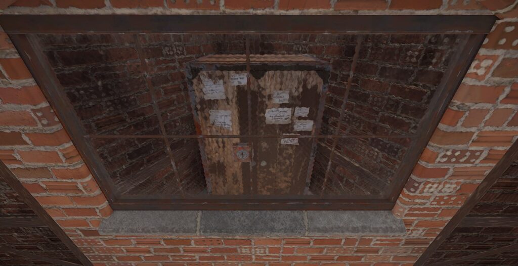 A Tool Cupboard locked and secured behind a metal window.