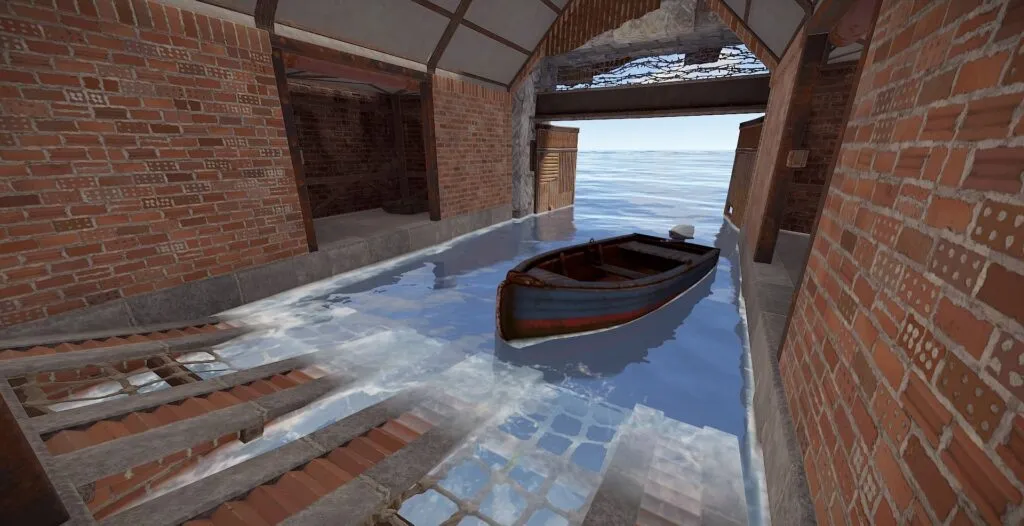 A Rowboat inside the garage with the doors open
