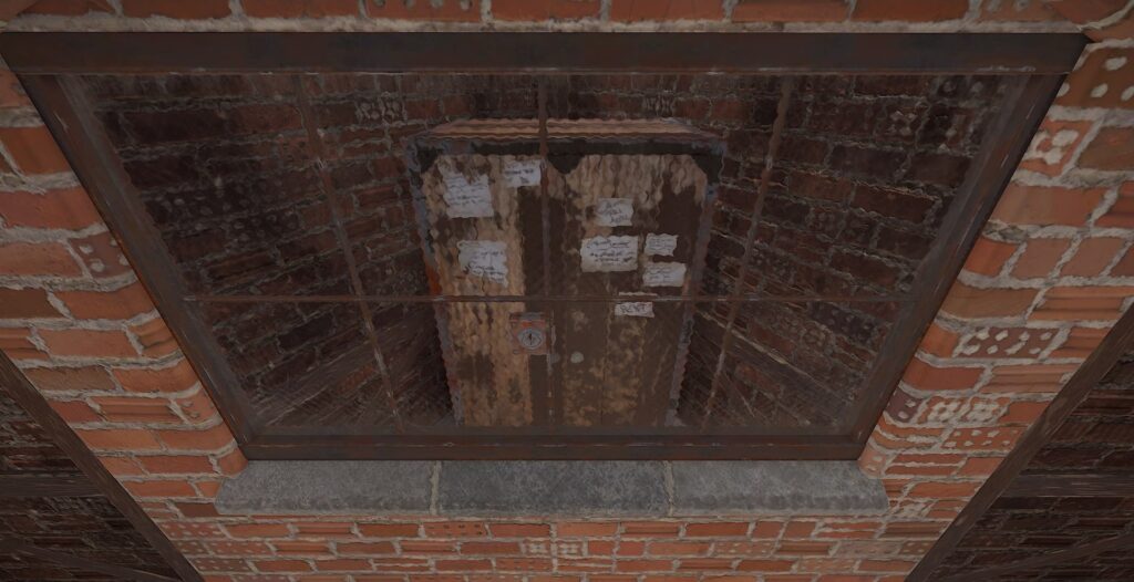 A locked Tool Cupboard enclosed behind metal bars