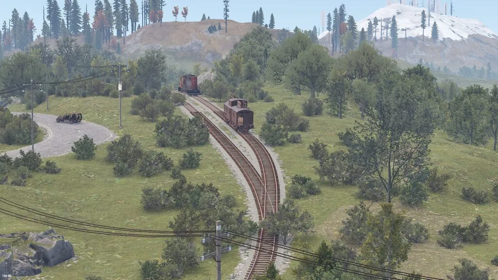 Parallel track lines with a large locomotive and caboose