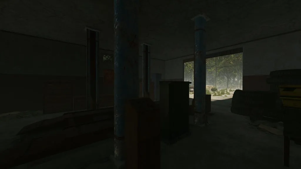 Inside Oxum's Gas Station Car Lift in a Down Position